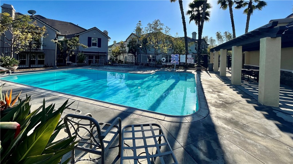7701 Chambray Place, Unit 2 Rancho Cucamonga, CA 91739 - Photo 32 of 39 a swimming pool with outdoor seating and yard