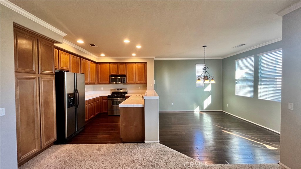 7701 Chambray Place, Unit 2 Rancho Cucamonga, CA 91739 - Photo 7 of 39 a view of a electric appliances in kitchen and an empty room
