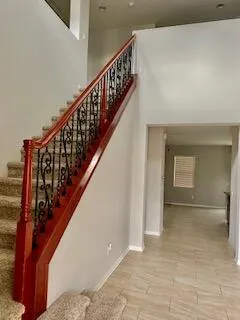 a kitchen with stainless steel appliances granite countertop a stove a sink dishwasher and a refrigerator