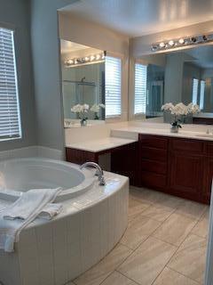 4403 Edam Street Lancaster, CA 93536 - Photo 13 of 20 a bathroom with a sink and a mirror