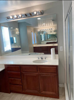 4403 Edam Street Lancaster, CA 93536 - Photo 14 of 20 a bathroom with a sink and a mirror
