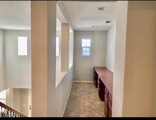 4403 Edam Street Lancaster, CA 93536 - Photo 19 of 20 a view of a hallway with windows