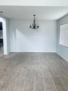 a view of a hallway with windows