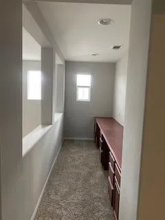 a view of an empty room and window