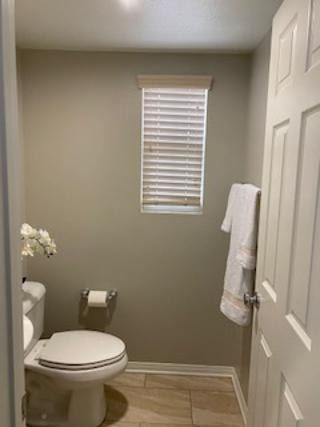 4403 Edam Street Lancaster, CA 93536 - Photo 5 of 20 a bathroom with a toilet and a shower