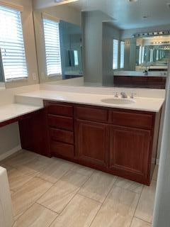 4403 Edam Street Lancaster, CA 93536 - Photo 10 of 20 a bathroom with a sink and a mirror