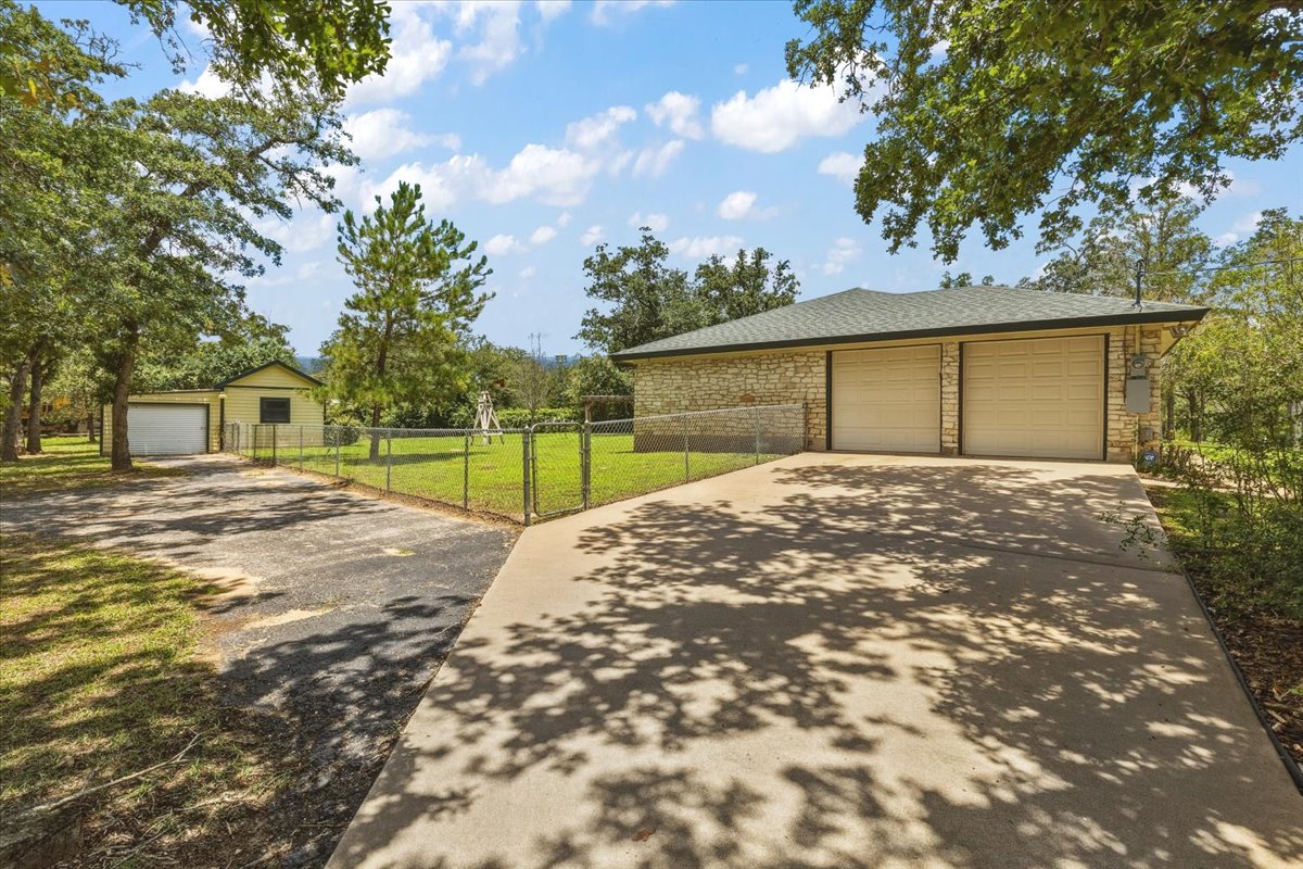 250 Hickory Drive Elgin, TX 78621 - Photo 31 of 37 a front view of a house with a yard and garage
