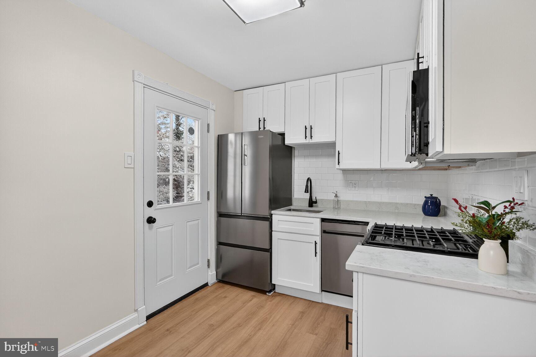 8 Melbourne Avenue Silver Spring, MD 20901 - Photo 5 of 23 Kitchen has easy access to the backyard patio