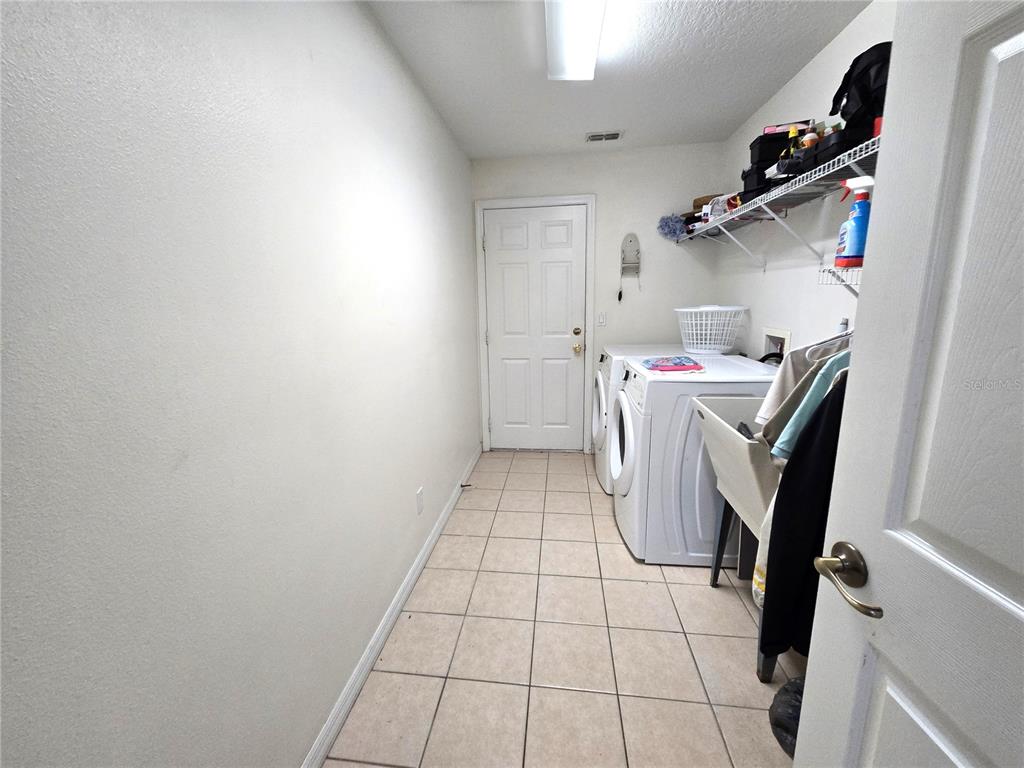 4300 Northwest 4th Circle Ocala, FL 34475 - Photo 22 of 34 a utility room with dryer and washer