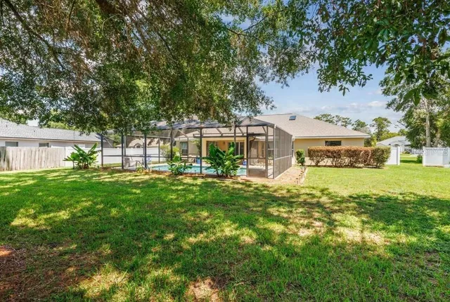 a front view of a house with a yard table and chairs