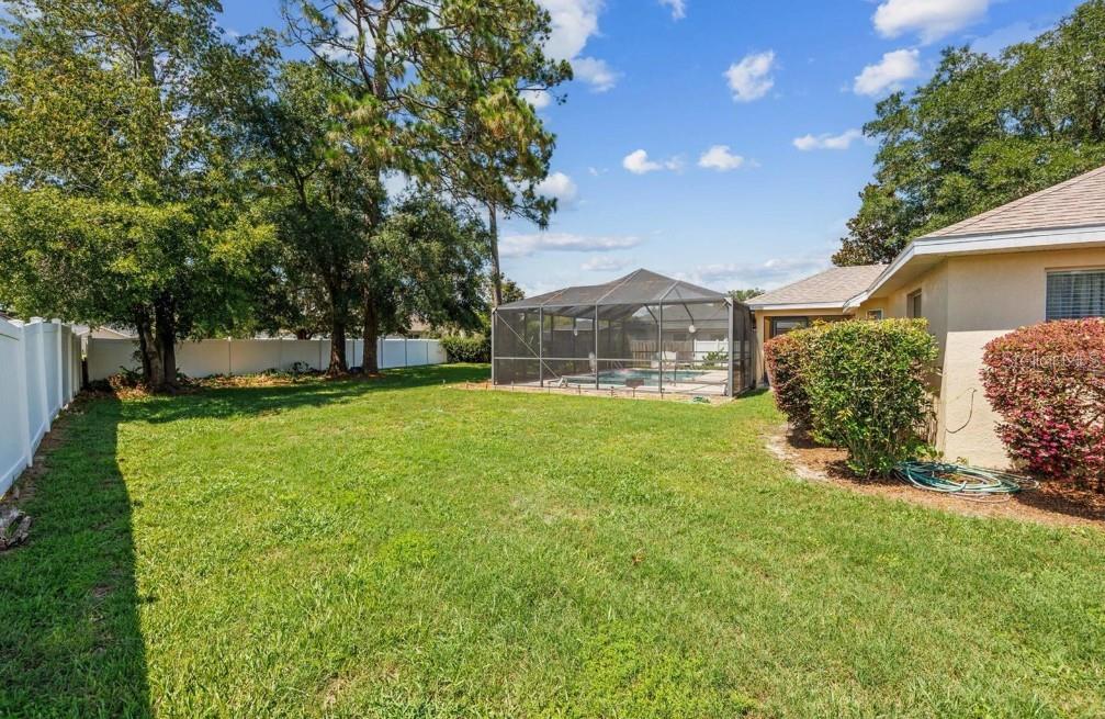 4300 Northwest 4th Circle Ocala, FL 34475 - Photo 30 of 34 a view of a house with a big yard and large tree