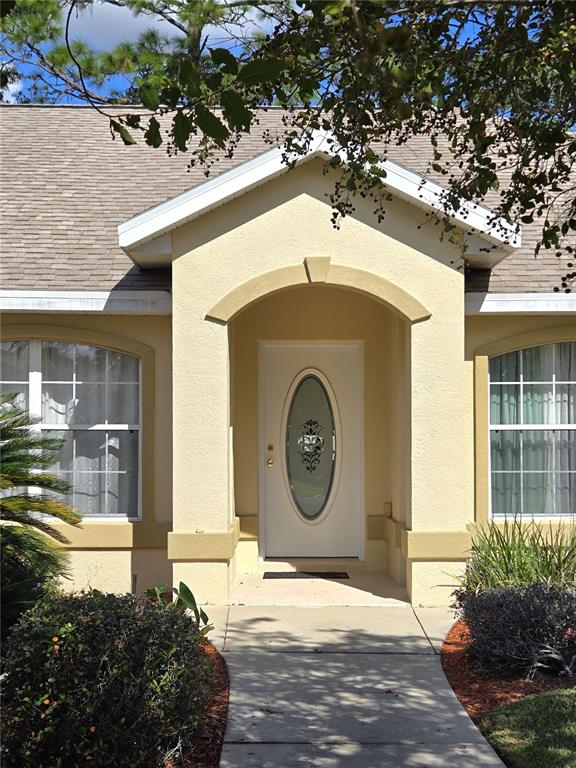 4300 Northwest 4th Circle Ocala, FL 34475 - Photo 3 of 34 a house with trees in front of it