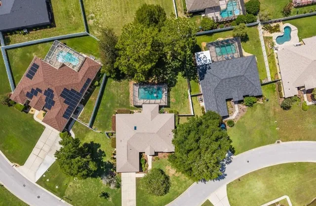 an aerial view of a house with a swimming pool