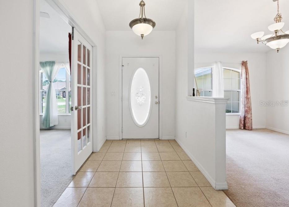 4300 Northwest 4th Circle Ocala, FL 34475 - Photo 4 of 34 a view of a livingroom with wooden floor and a ceiling fan