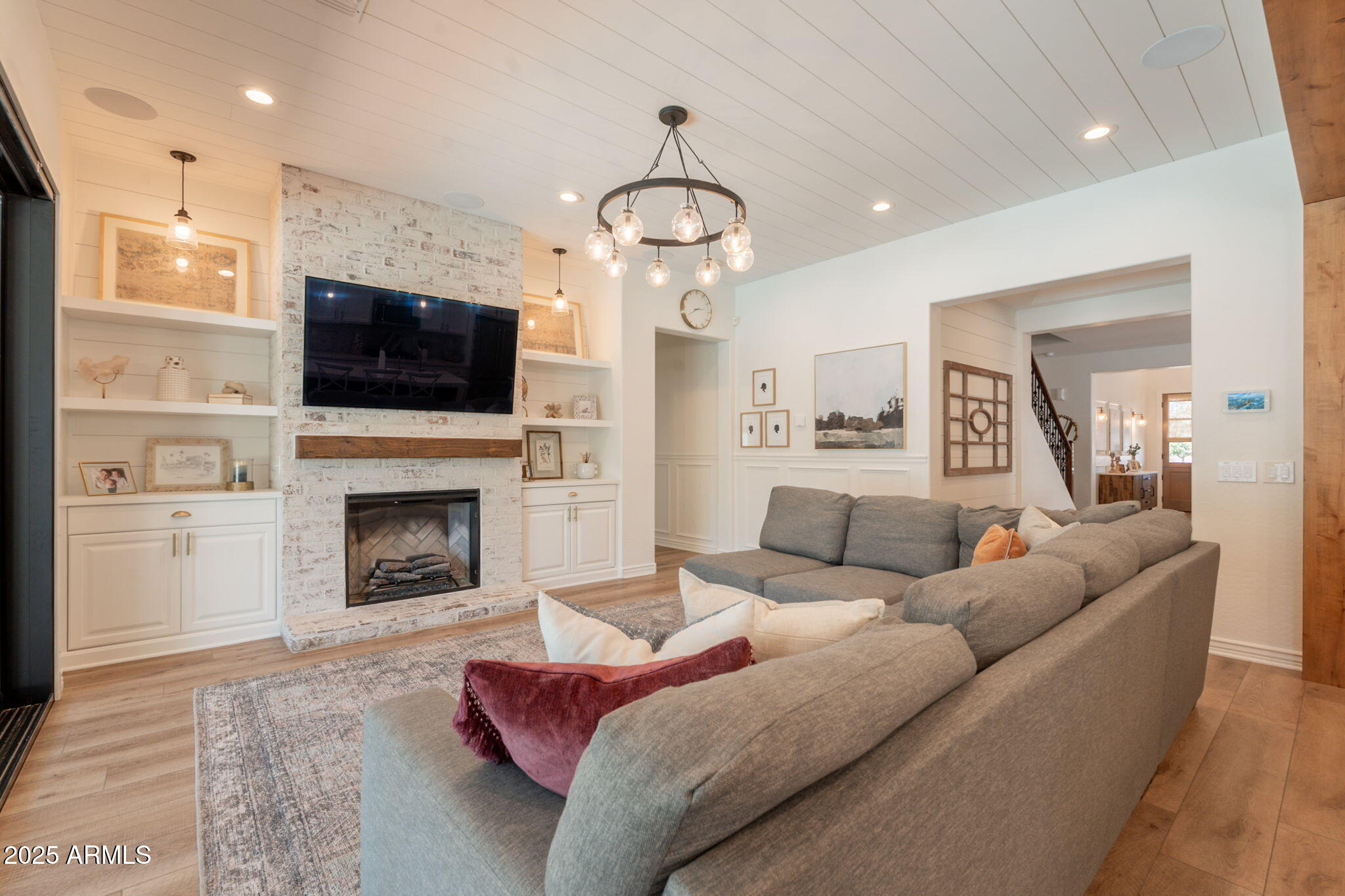 3931 East Weather Vane Road Gilbert, AZ 85296 - Photo 13 of 83 a living room with furniture a fireplace and a flat screen tv