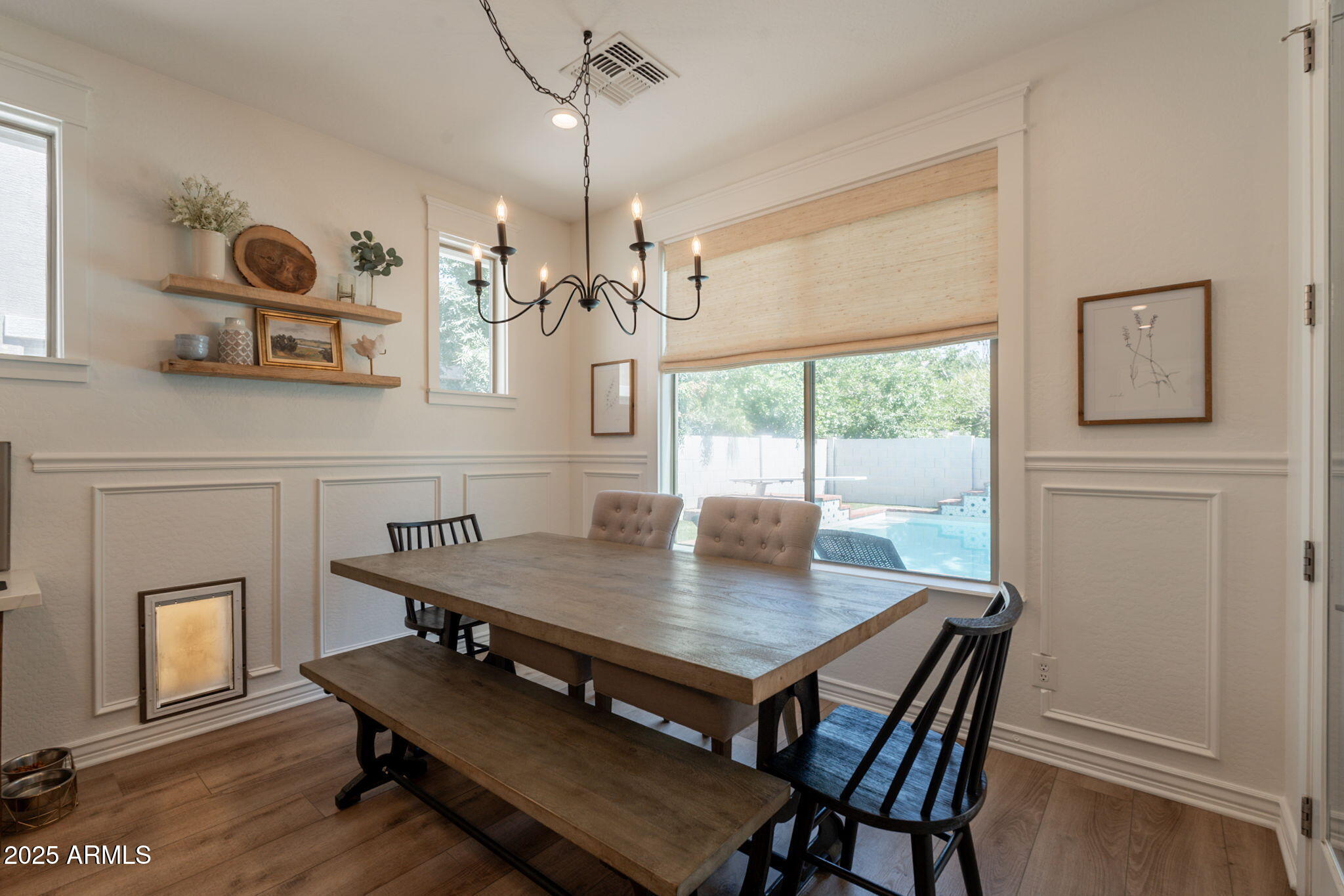 3931 East Weather Vane Road Gilbert, AZ 85296 - Photo 14 of 83 a view of a dining room with furniture window and wooden floor
