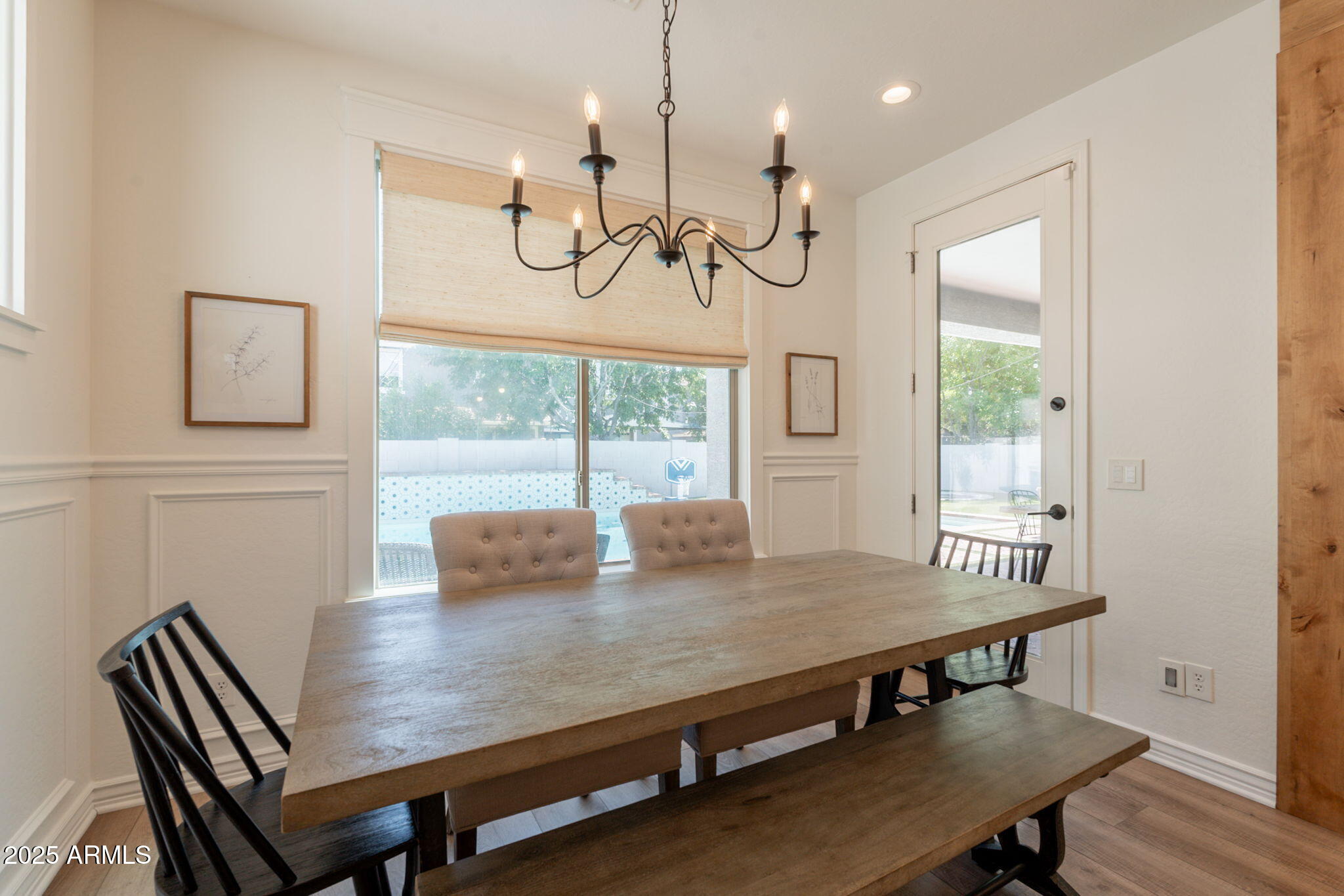 3931 East Weather Vane Road Gilbert, AZ 85296 - Photo 15 of 83 a view of a dining room with furniture window and wooden floor