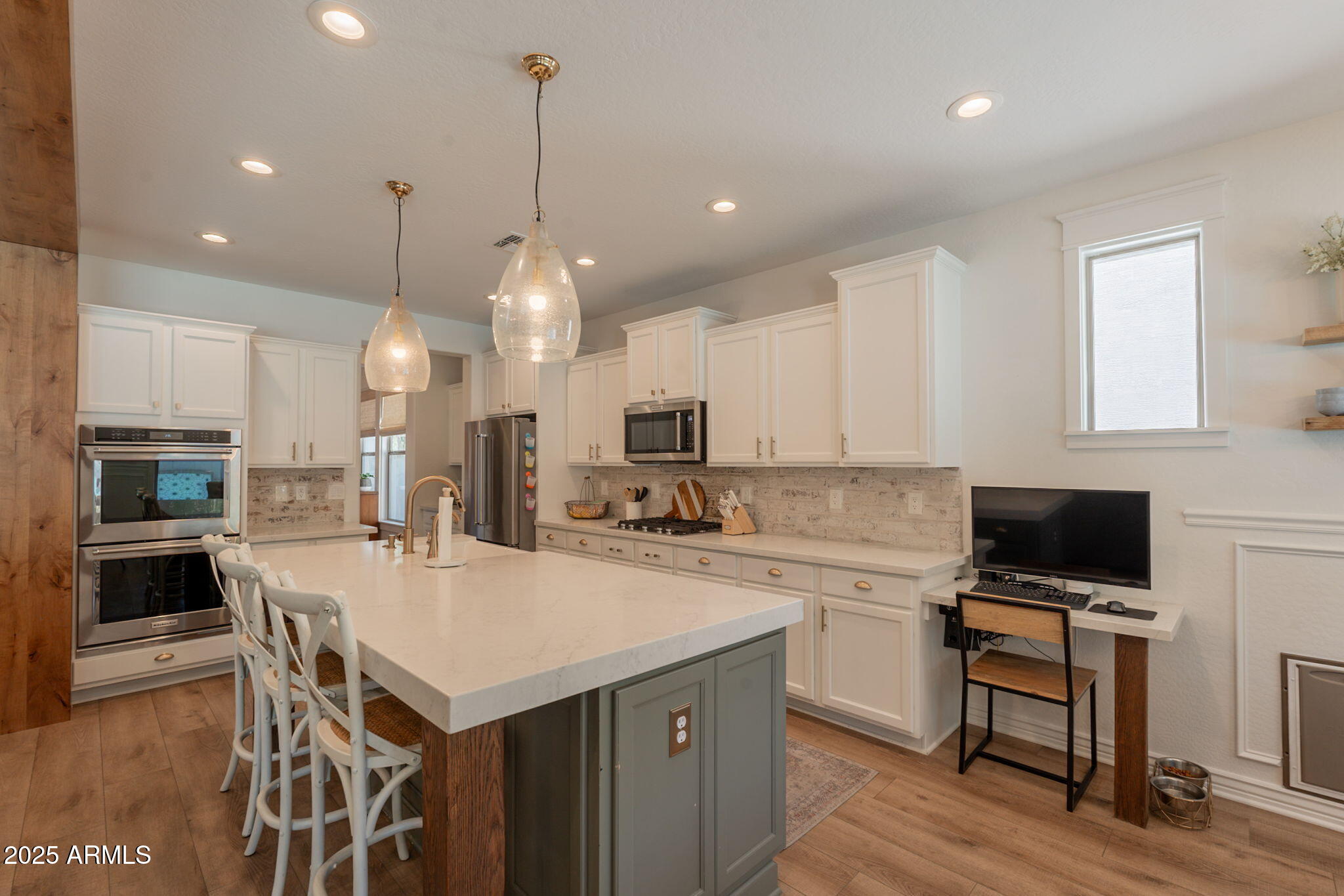 3931 East Weather Vane Road Gilbert, AZ 85296 - Photo 19 of 83 a kitchen with a stove a refrigerator and a stove top oven