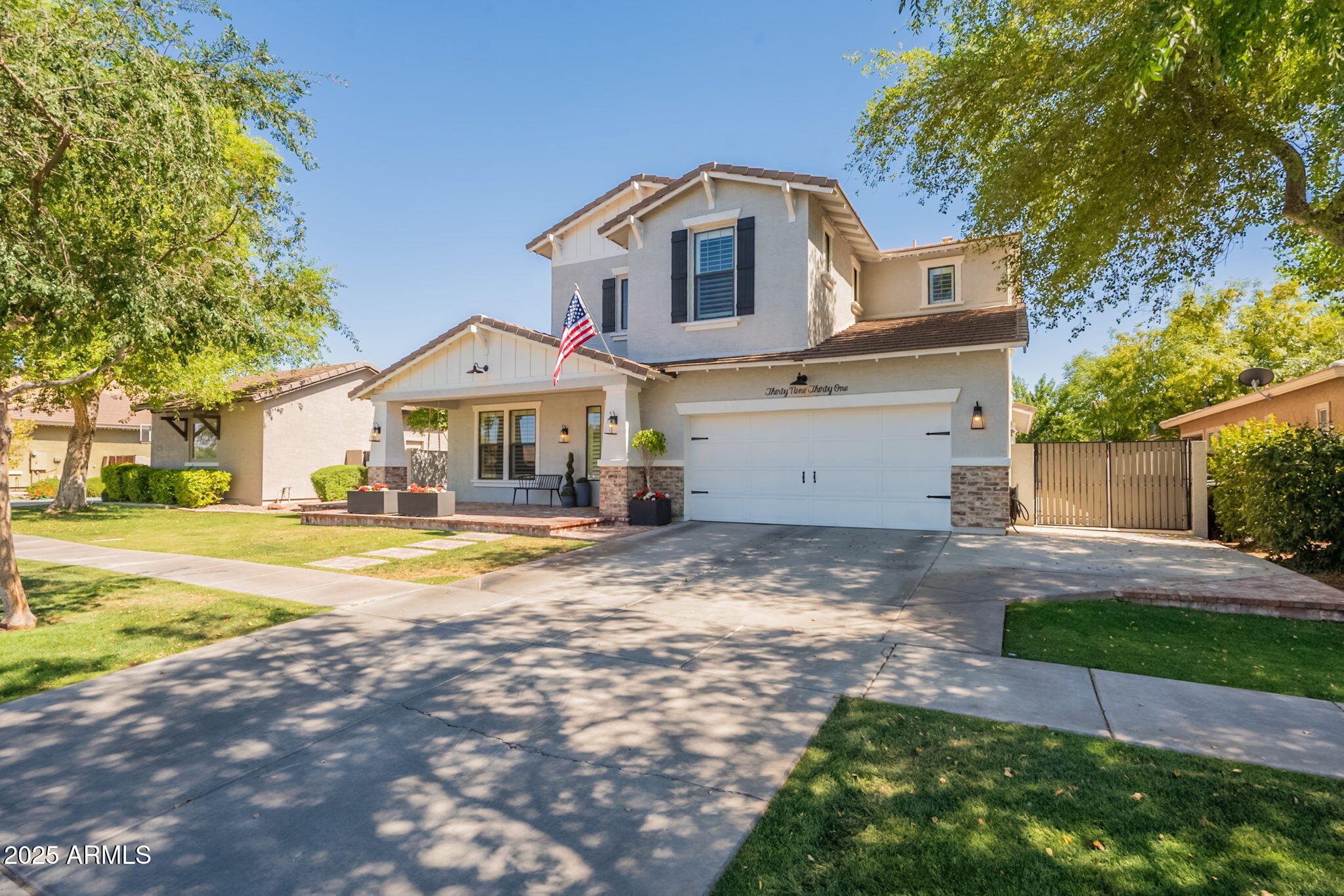 3931 East Weather Vane Road Gilbert, AZ 85296 - Photo 2 of 83 a front view of a house with a yard and garage