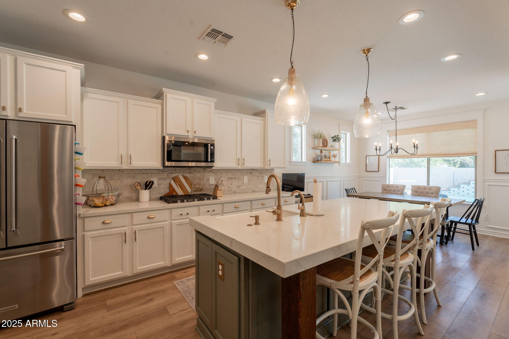 3931 East Weather Vane Road Gilbert, AZ 85296 - Photo 21 of 83 a kitchen with a center island appliances and cabinets