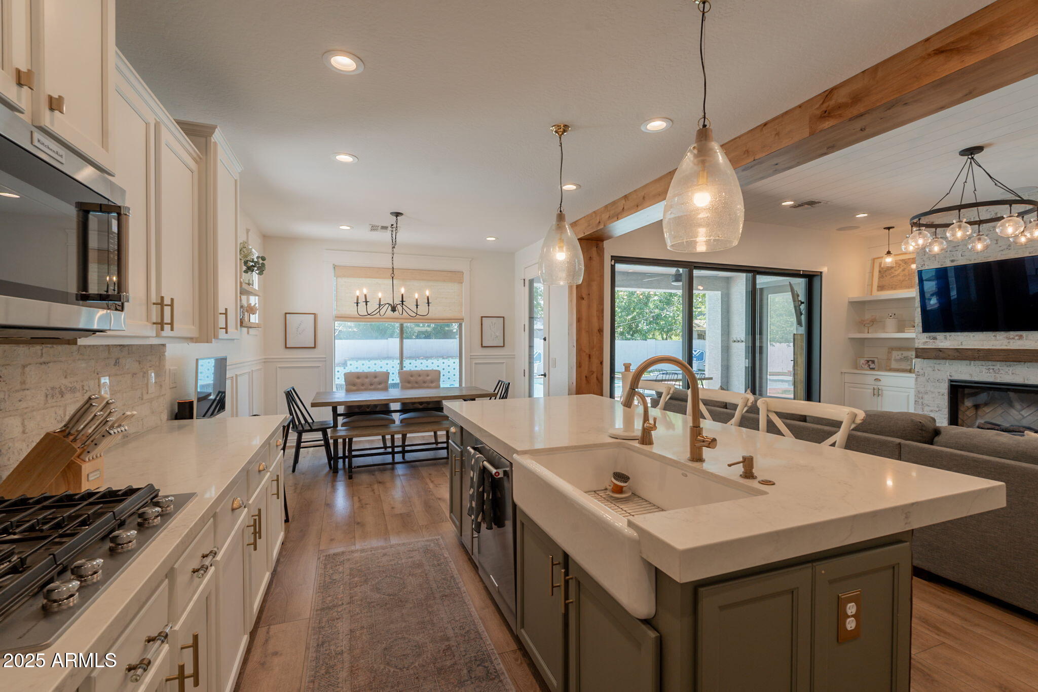 3931 East Weather Vane Road Gilbert, AZ 85296 - Photo 24 of 83 a kitchen with counter top space a sink appliances and cabinets