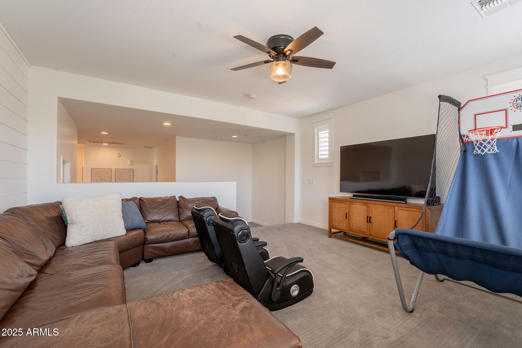 3931 East Weather Vane Road Gilbert, AZ 85296 - Photo 43 of 83 a living room with furniture and a flat screen tv