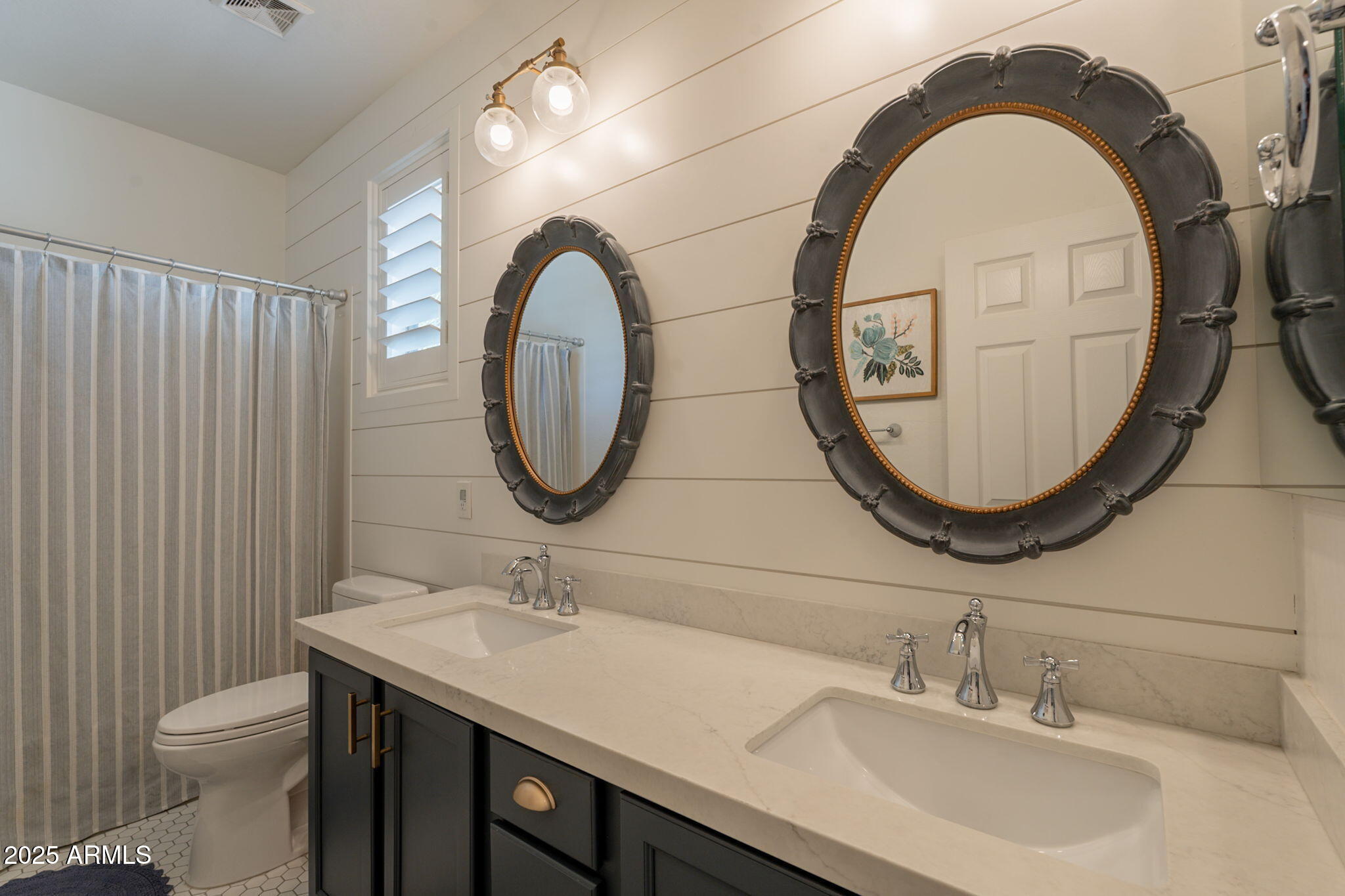 3931 East Weather Vane Road Gilbert, AZ 85296 - Photo 47 of 83 a bathroom with a sink a mirror and a toilet