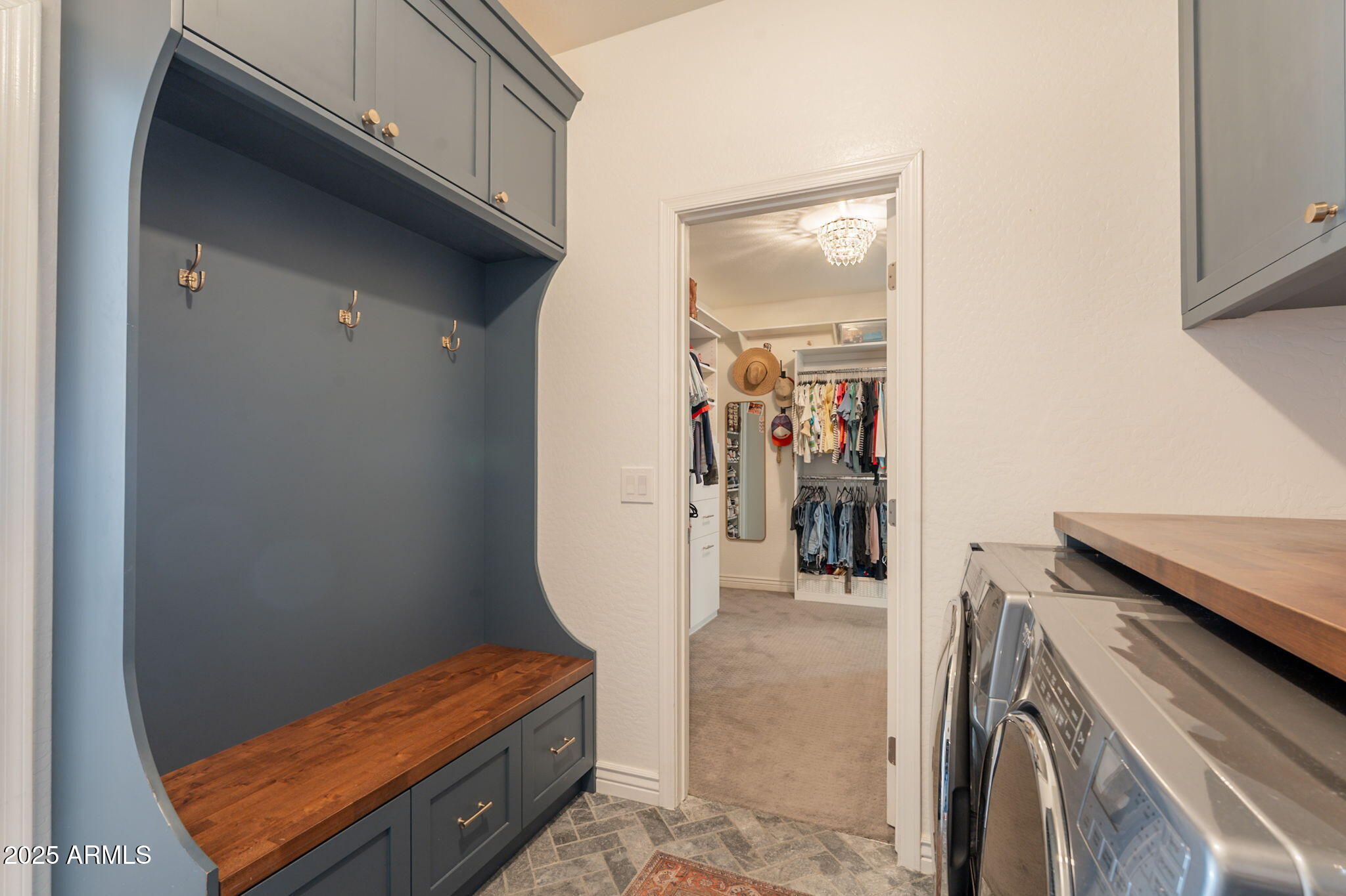 3931 East Weather Vane Road Gilbert, AZ 85296 - Photo 57 of 83 a view of walk in closet with clothes and shoes