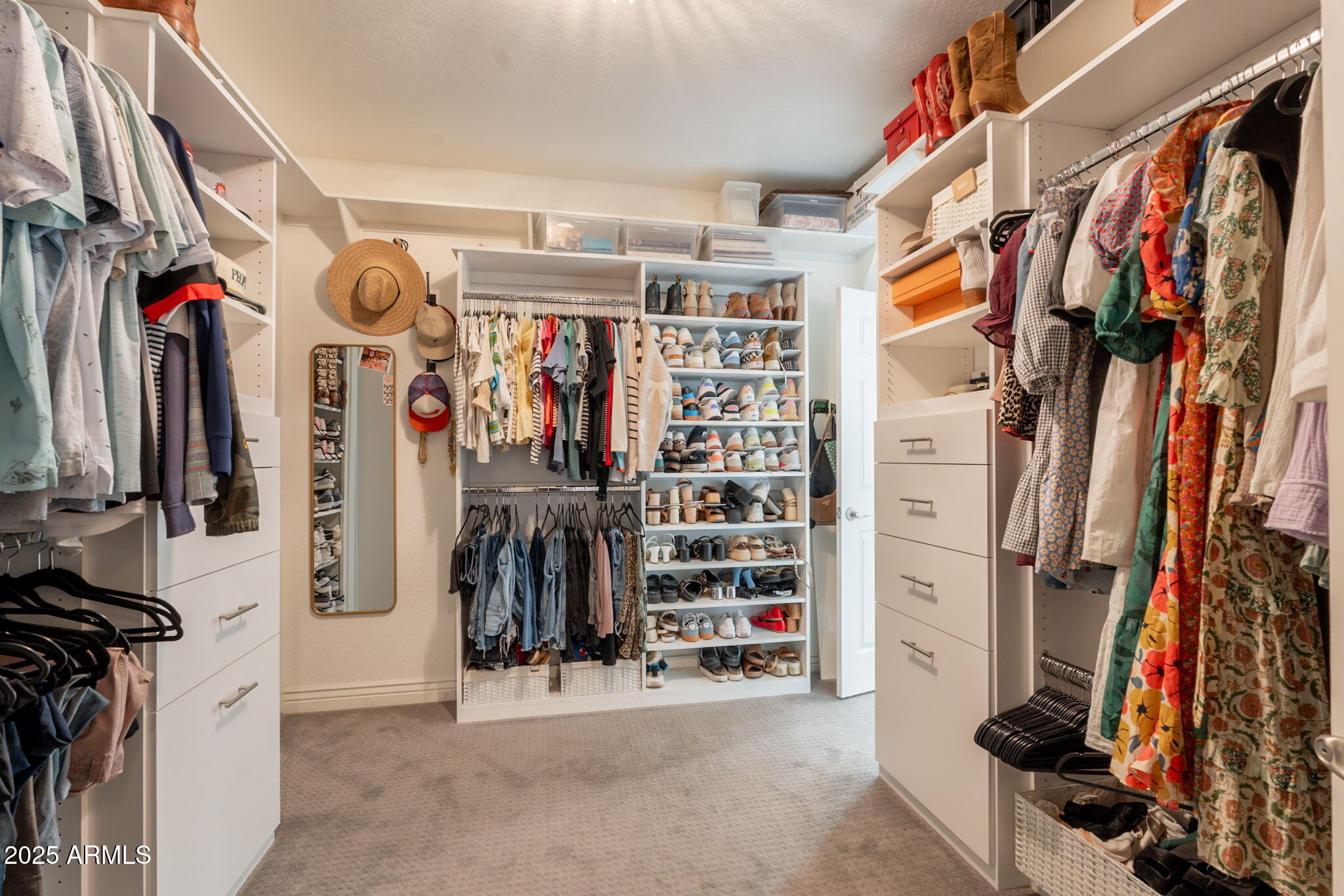 3931 East Weather Vane Road Gilbert, AZ 85296 - Photo 58 of 83 a view of walk in closet with clothes