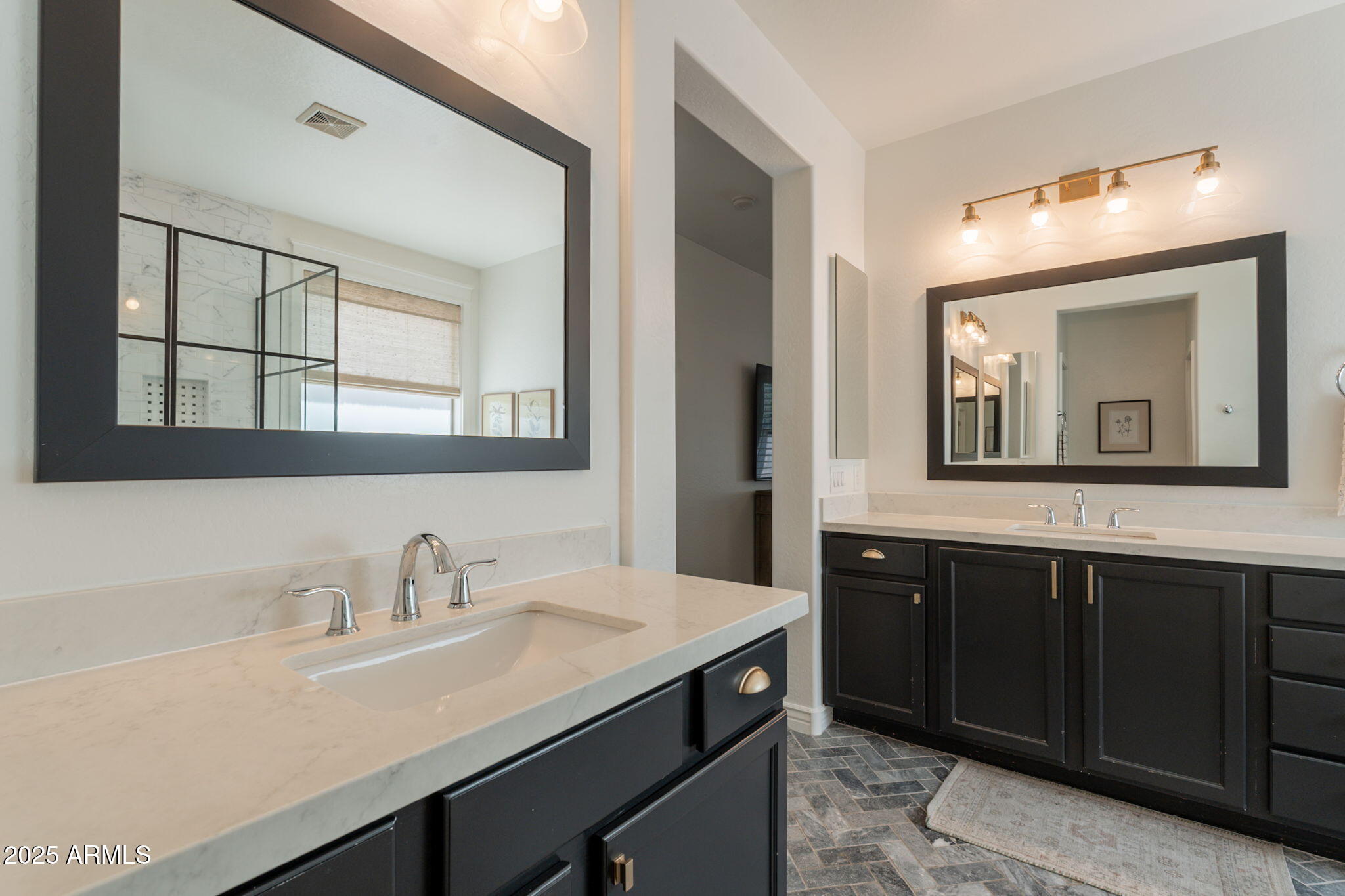 3931 East Weather Vane Road Gilbert, AZ 85296 - Photo 62 of 83 a bathroom with a sink and a mirror