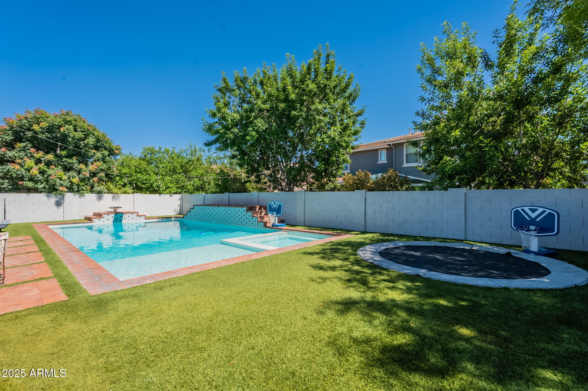 3931 East Weather Vane Road Gilbert, AZ 85296 - Photo 71 of 83 a view of a backyard with a small pool