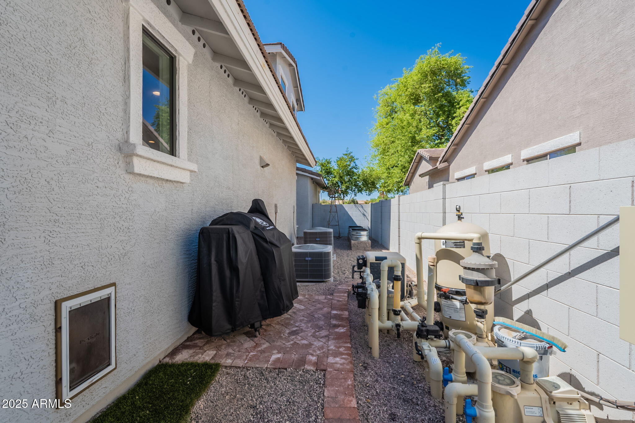 3931 East Weather Vane Road Gilbert, AZ 85296 - Photo 75 of 83 a view of a porch with furniture and potted plants