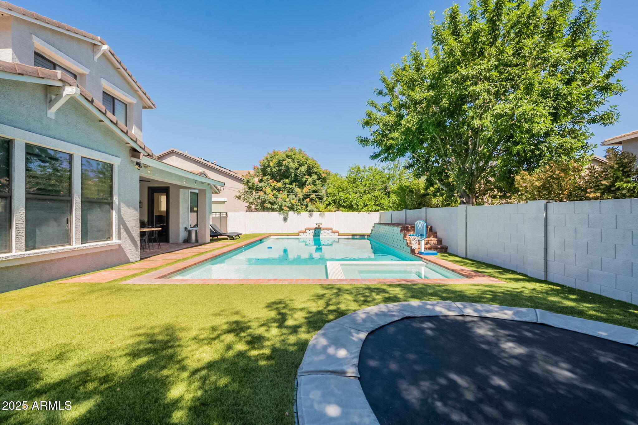 3931 East Weather Vane Road Gilbert, AZ 85296 - Photo 83 of 83 a view of a swimming pool with an outdoor space