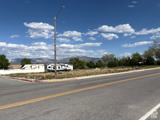 480 North Main Street, Unit 7 8 Milford, UT 84751 - Photo 8 of 11 View of asphalt street with a mountain view, street lighting, and curbs