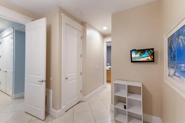 a view of a livingroom with wooden floor and a flat screen tv
