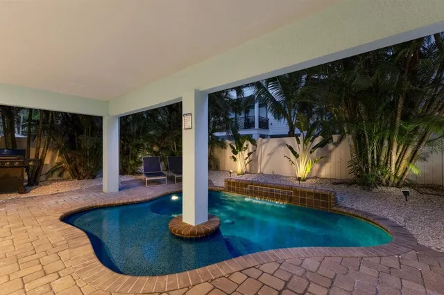 a view of a house with backyard and porch