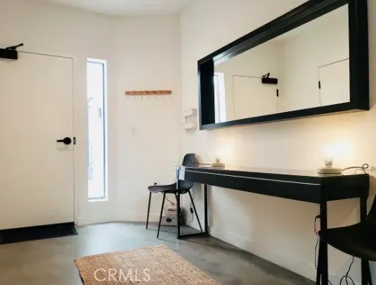 a bathroom with a sink a mirror and a window