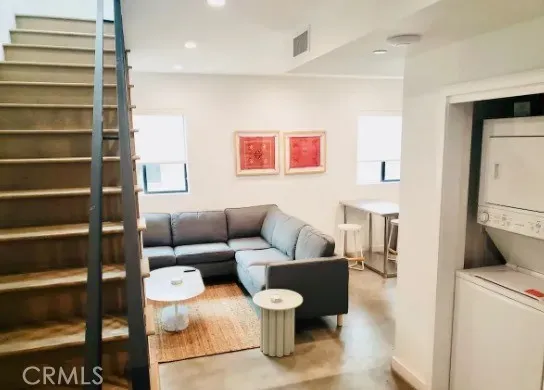 a living room with furniture and a rug