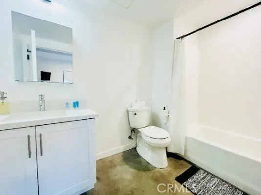 a bathroom with a sink toilet and vanity