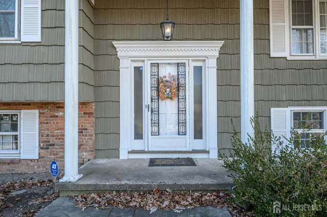 a front view of a house with a porch