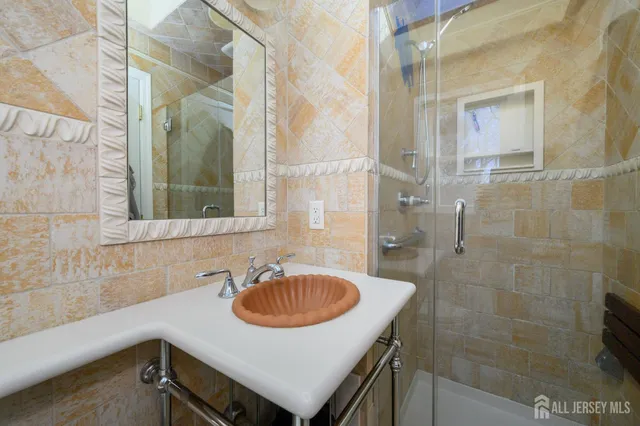 a bathroom with a sink and a mirror