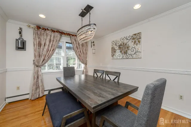 a dining room with furniture and window