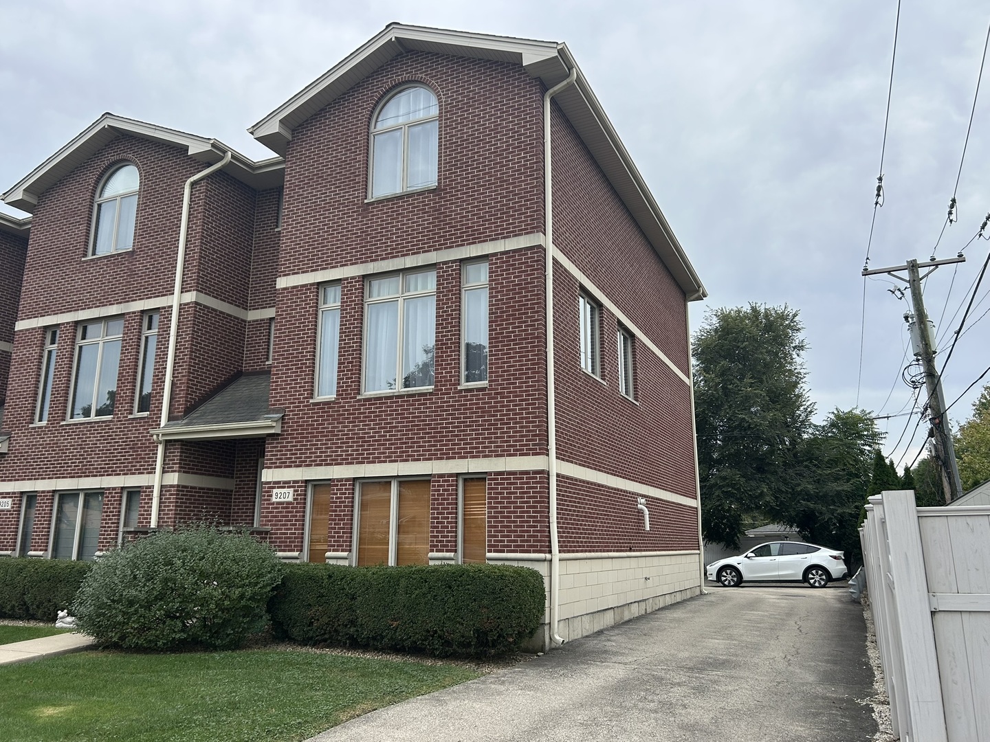 9207 Gerritsen Avenue, Unit 9207 Brookfield, IL 60513 - Photo 3 of 24 a front view of a house with a yard