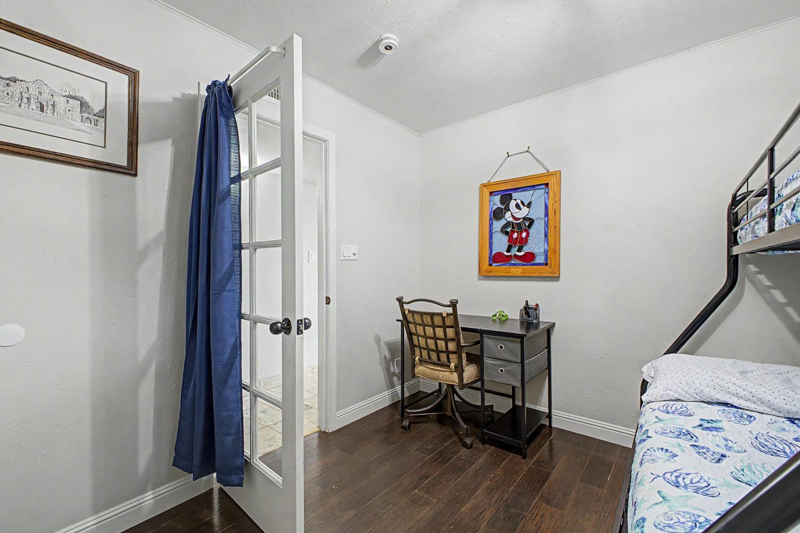 3346 East Cochise Road Phoenix, AZ 85028 - Photo 31 of 40 a view of a bedroom with furniture and wooden floor