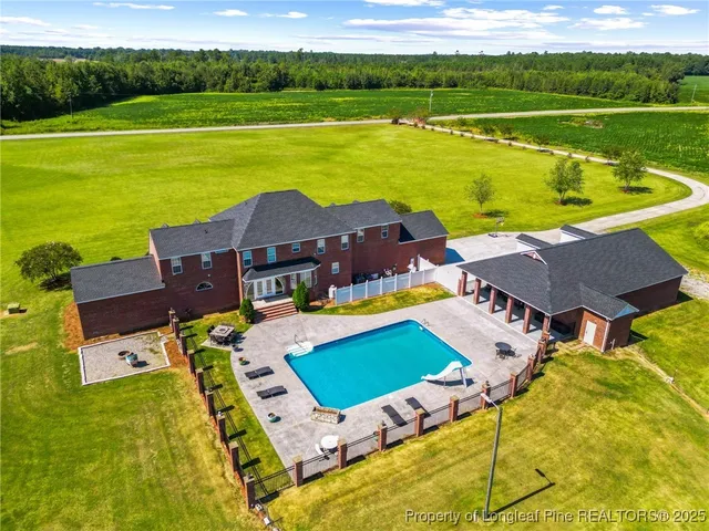 an aerial view of a house with a ocean view
