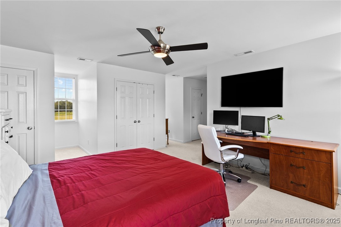 499 Price Road Fairmont, NC 28340 - Photo 32 of 50 a bedroom with a bed and a flat screen tv