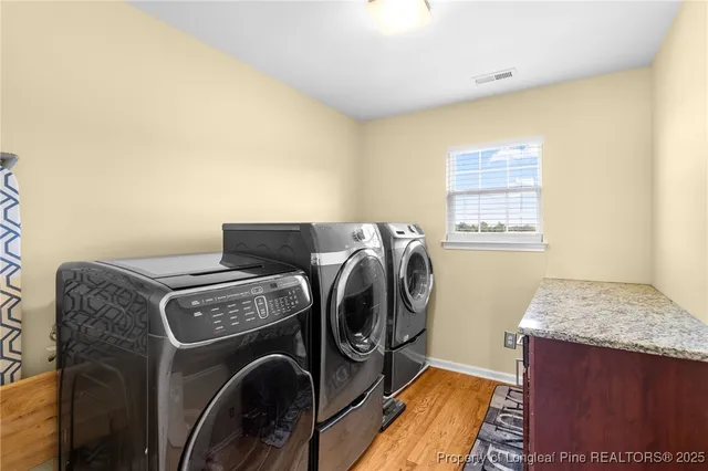 a utility room with dryer and washer
