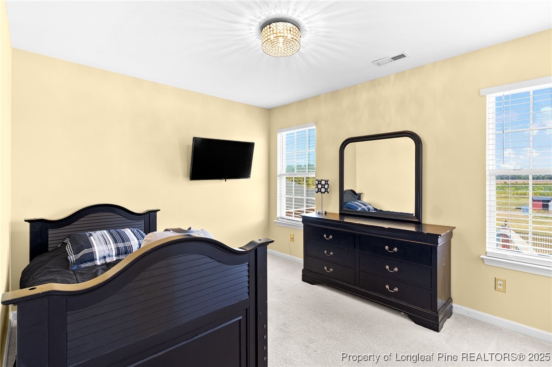 499 Price Road Fairmont, NC 28340 - Photo 34 of 50 a bedroom with a bed and a dresser