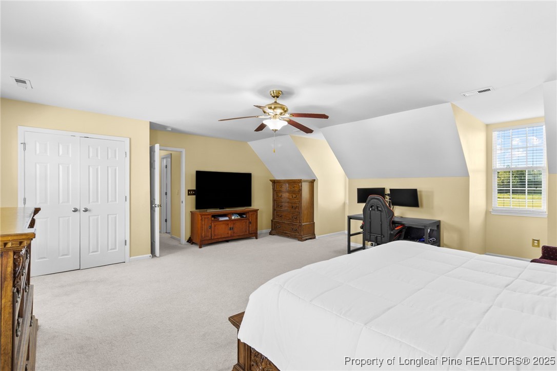 499 Price Road Fairmont, NC 28340 - Photo 38 of 50 a bed room with a bed a television and a large window