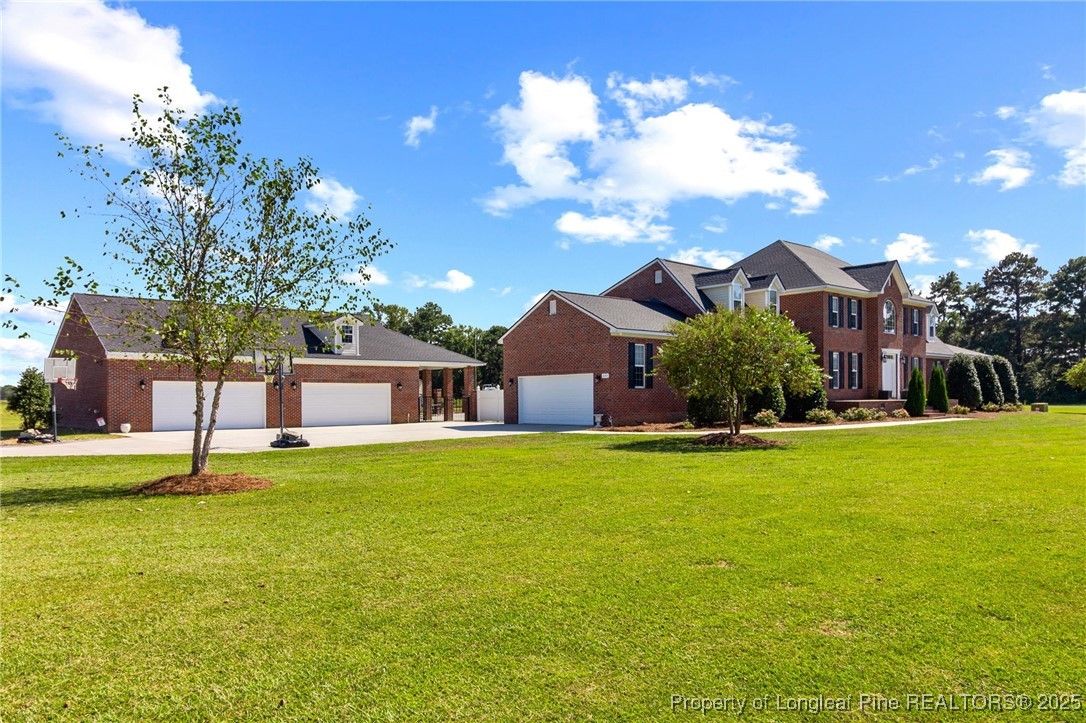 499 Price Road Fairmont, NC 28340 - Photo 4 of 50 a front view of house with yard and swimming pool